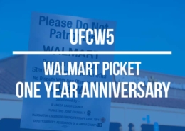Walmart picket one-year anniversary banner