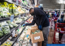 a grocery staff arranging items
