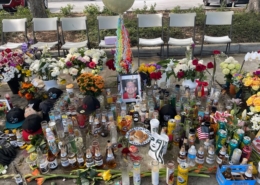 flowers and drinks in honor of a killed member